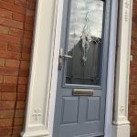 Light grey composite front door with traditional glazing